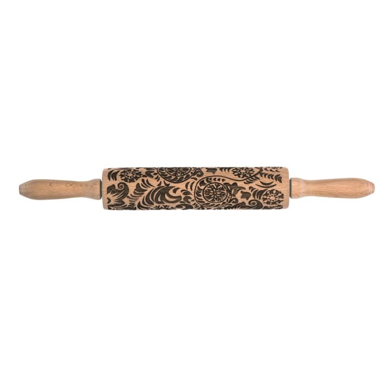 Wooden rolling pin with etched floral pattern on a white background