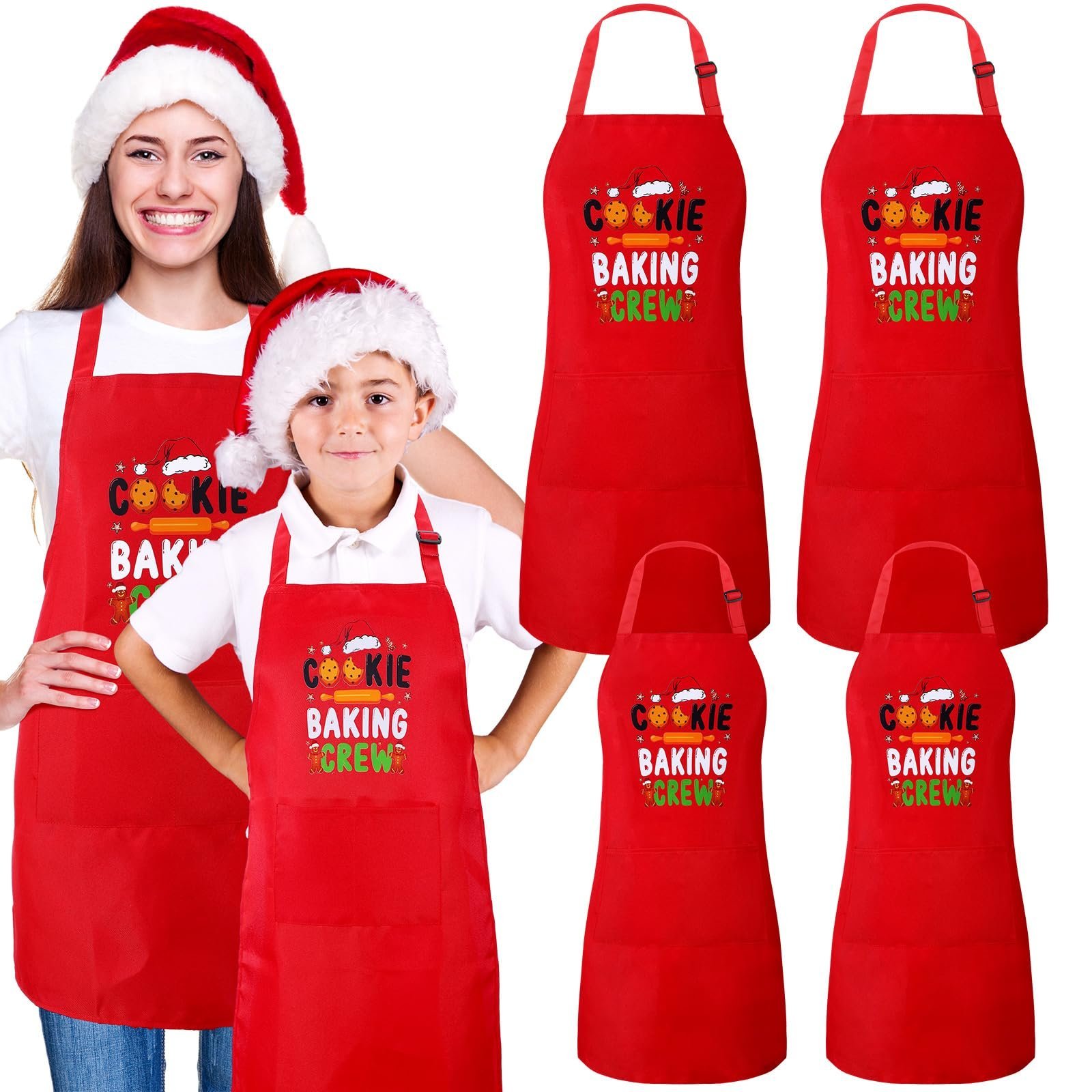 Woman and child in Santa hats, wearing red "Cookie Baking Crew" aprons