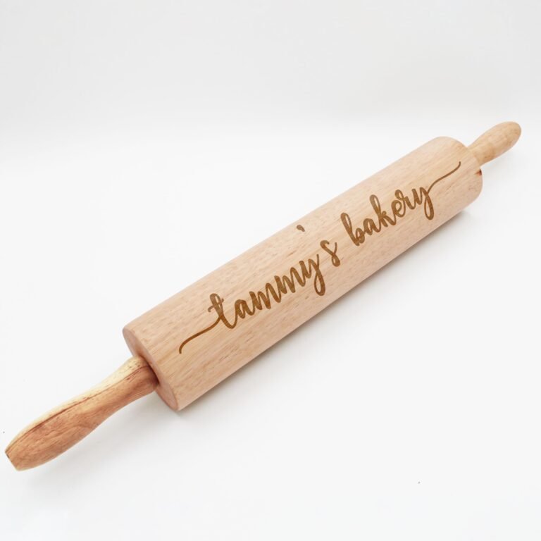 Wooden rolling pin with "Tammy's Bakery" engraved on the barrel