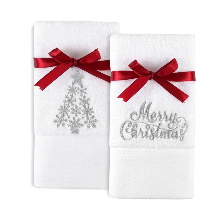 Two white Christmas towels with red bows and silver embroidery