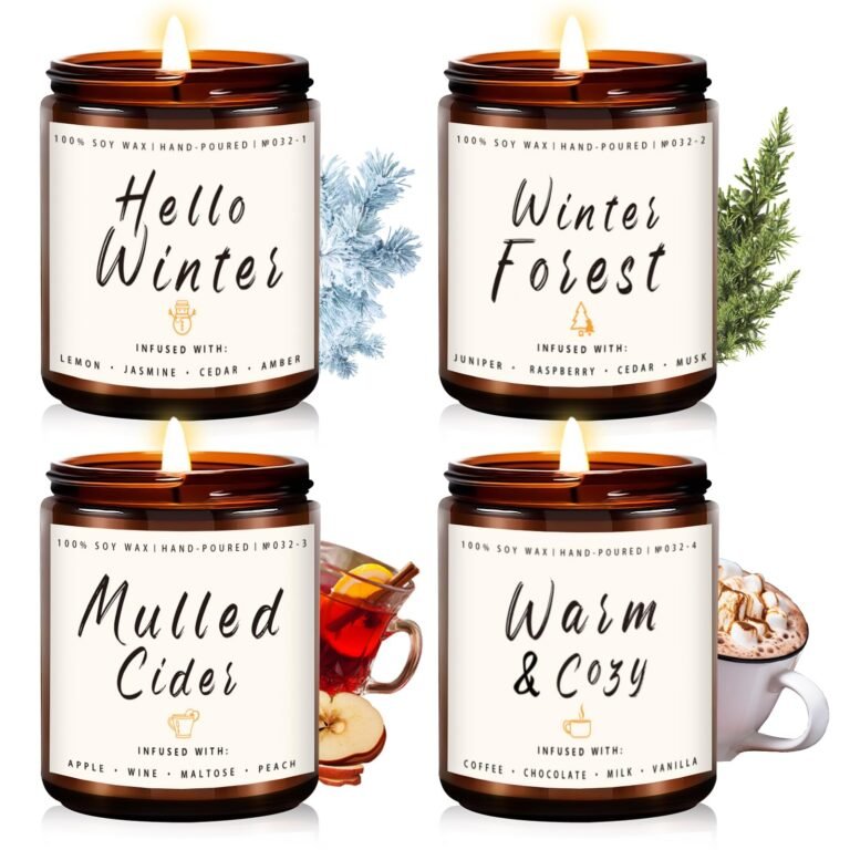 Four lit soy wax candles with winter-themed labels and accompanying decorations