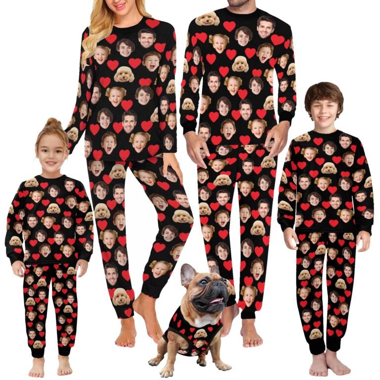 Family and dog wearing matching pajamas with faces and hearts on them