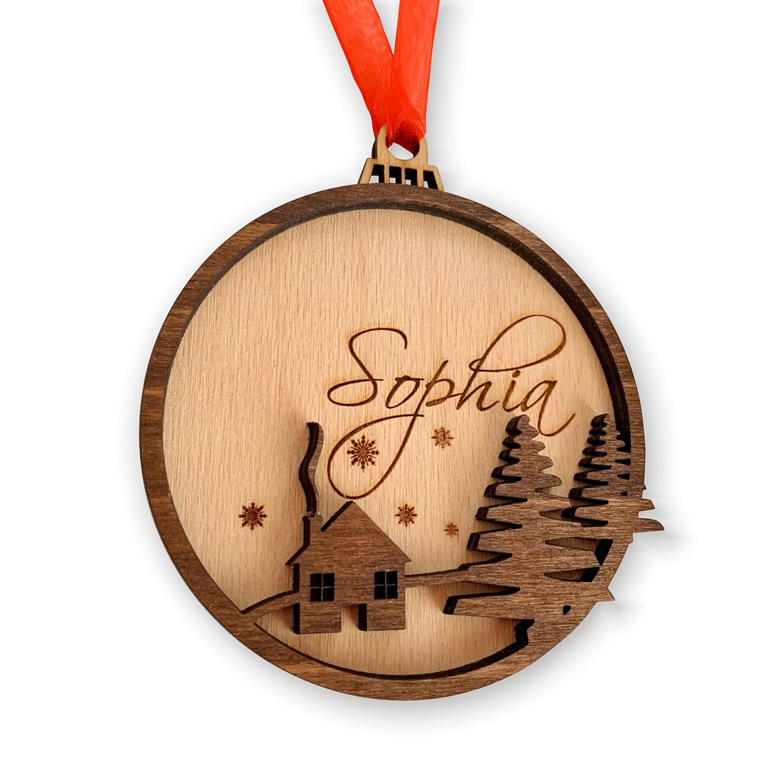 Wooden Christmas ornament with name "Sophia", house, trees, and red ribbon