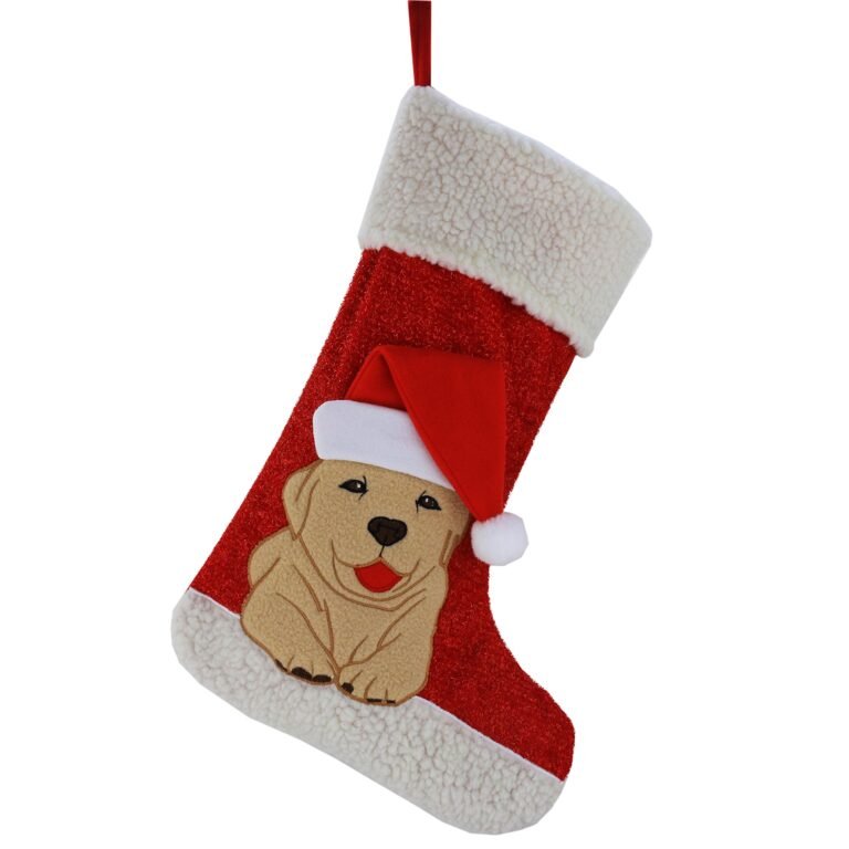 Red Christmas stocking with a dog wearing a Santa hat