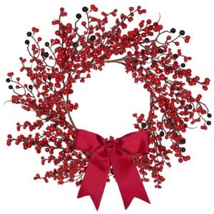 Berry wreath with red berries, black berries, and a red bow