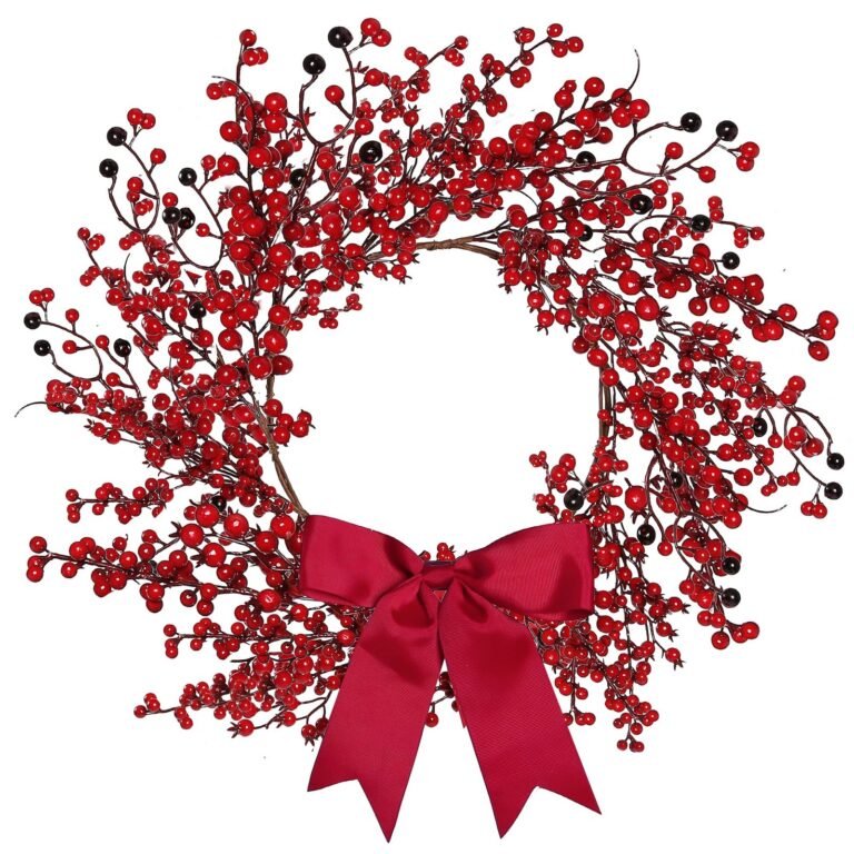 Berry wreath with red berries, black berries, and a red bow